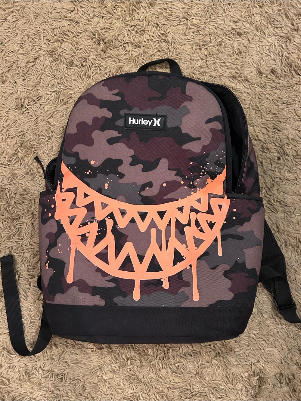 Hurley Camouflage Backpack with Orange Splash Graphic